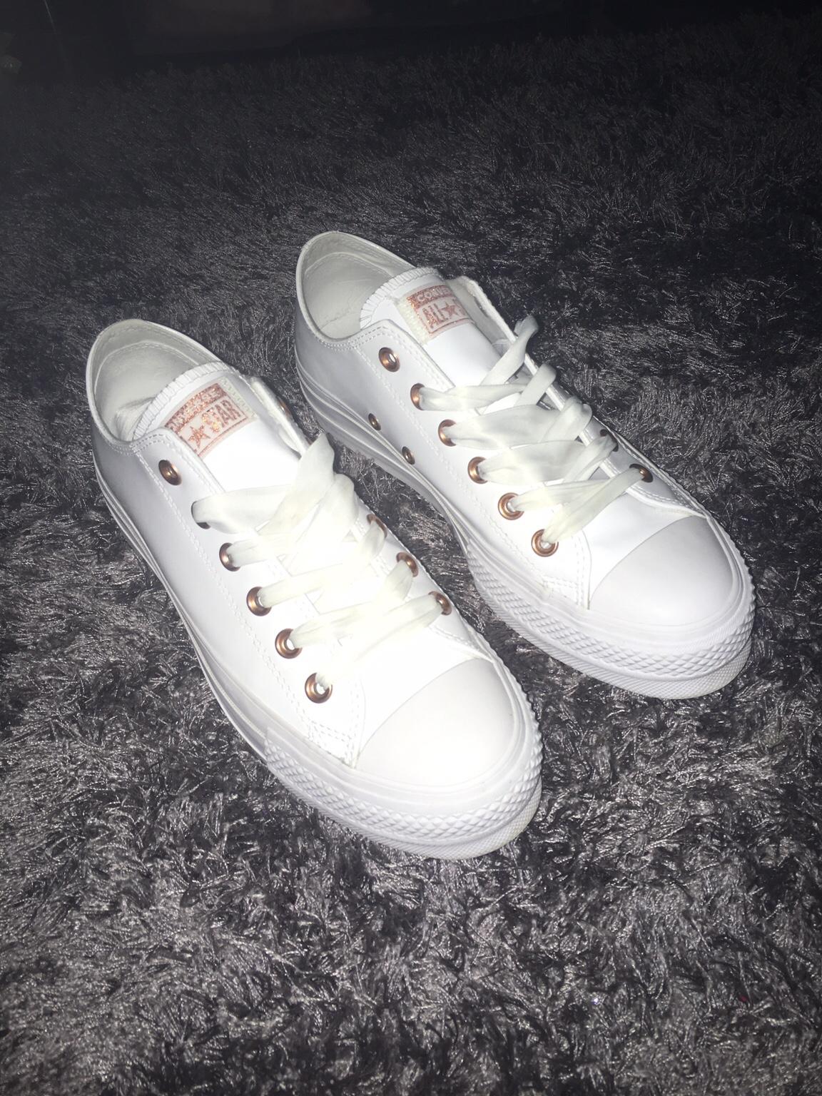 white and rose gold leather converse