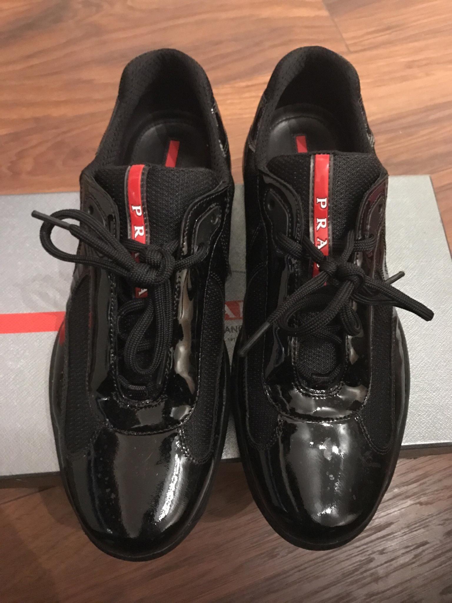 black shiny prada trainers