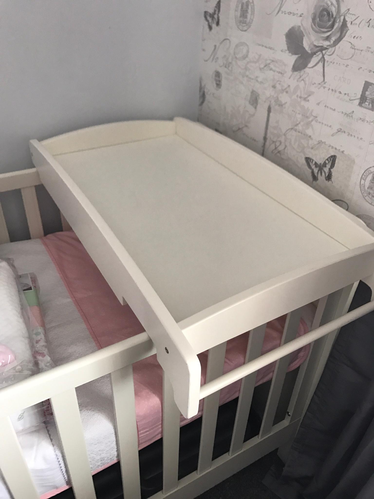 over the cot changing table