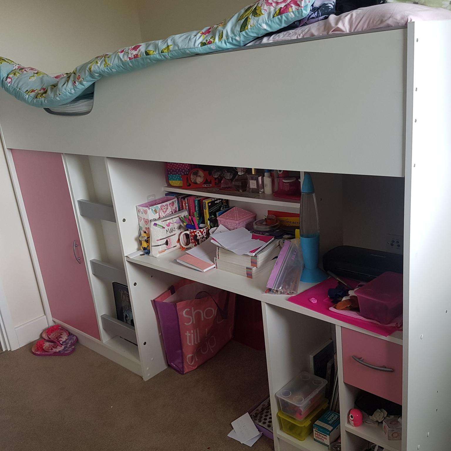 pink and white cabin bed