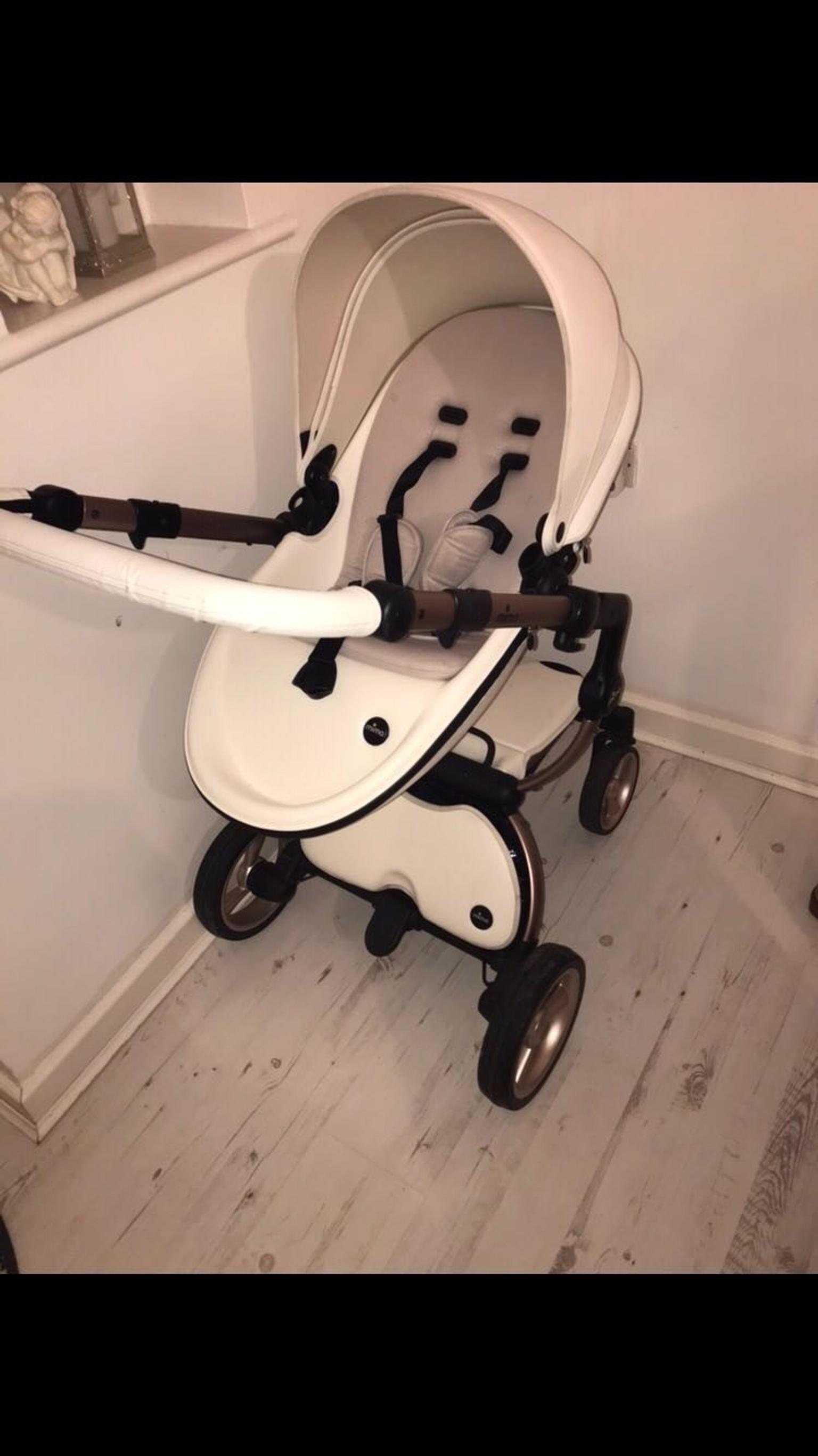 white and gold stroller