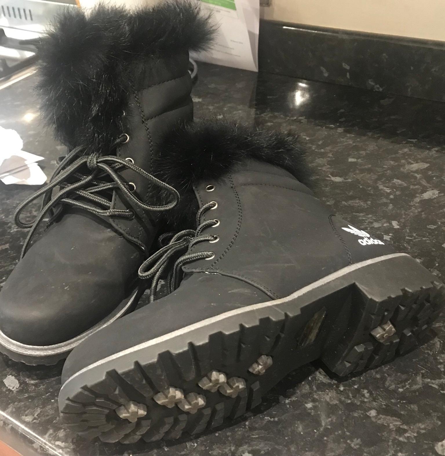 black adidas boots with fur