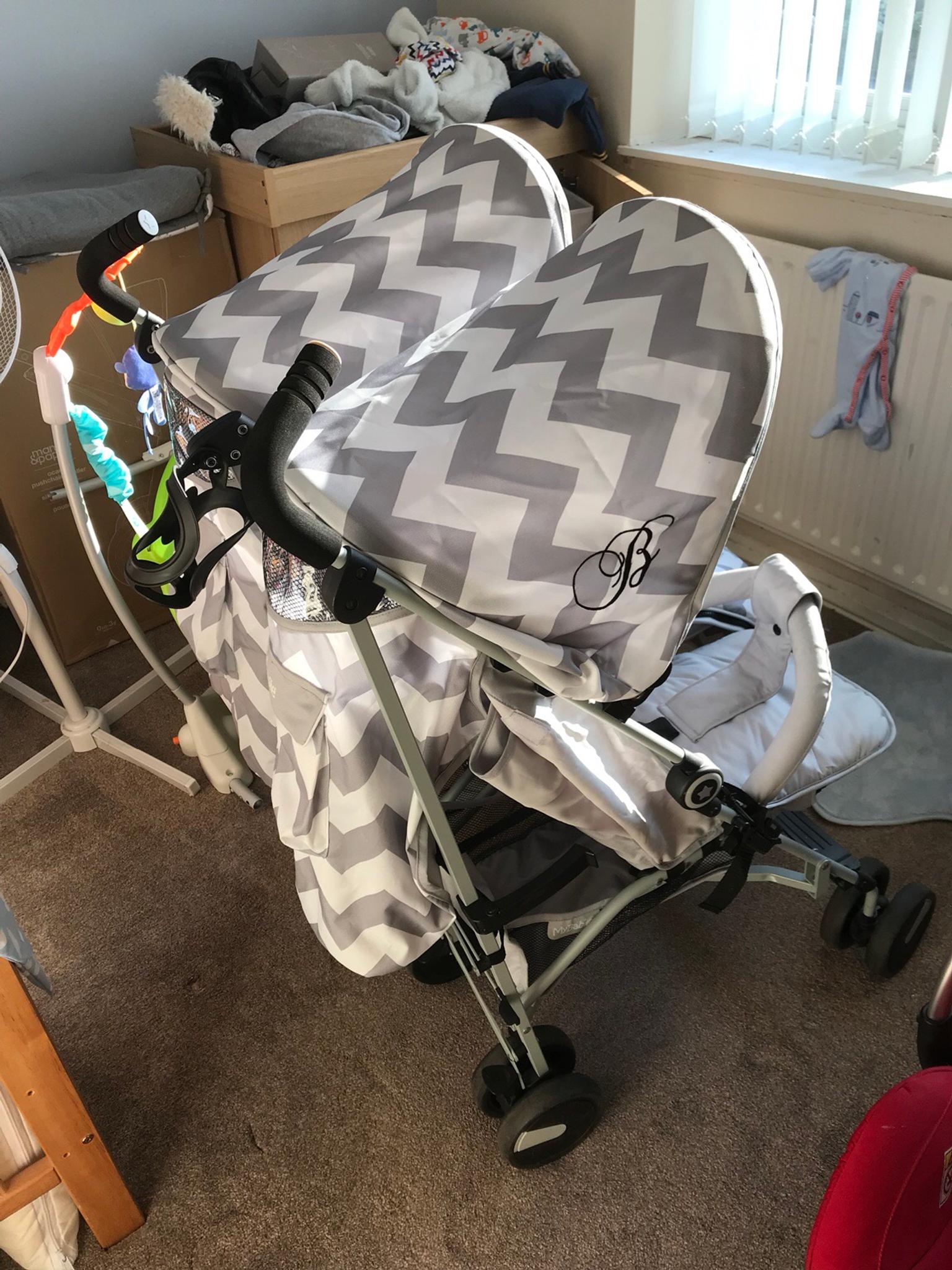 double stroller with footmuffs