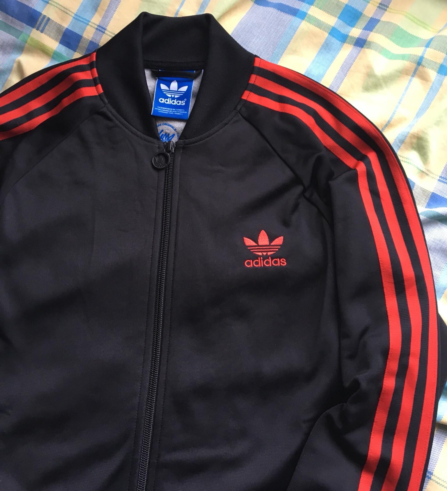 red adidas track top