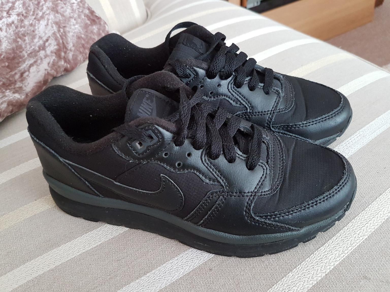 black size 4 trainers