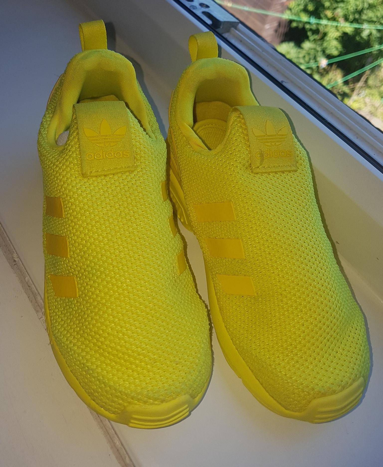 yellow adidas trainers