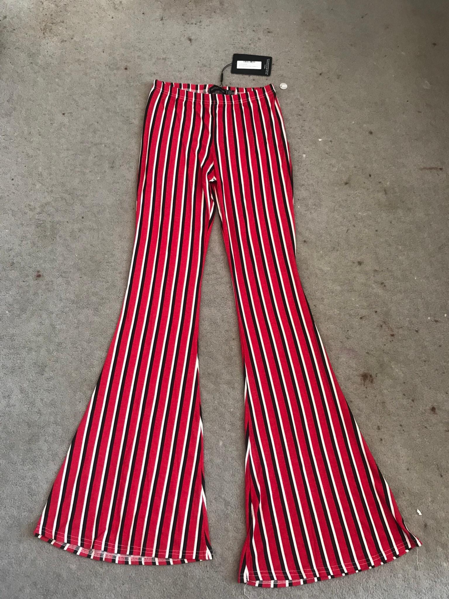 PRETTY LITTLE THING RED JERSEY VERTICAL STRIPE FLARED TROUSERS RRP £13