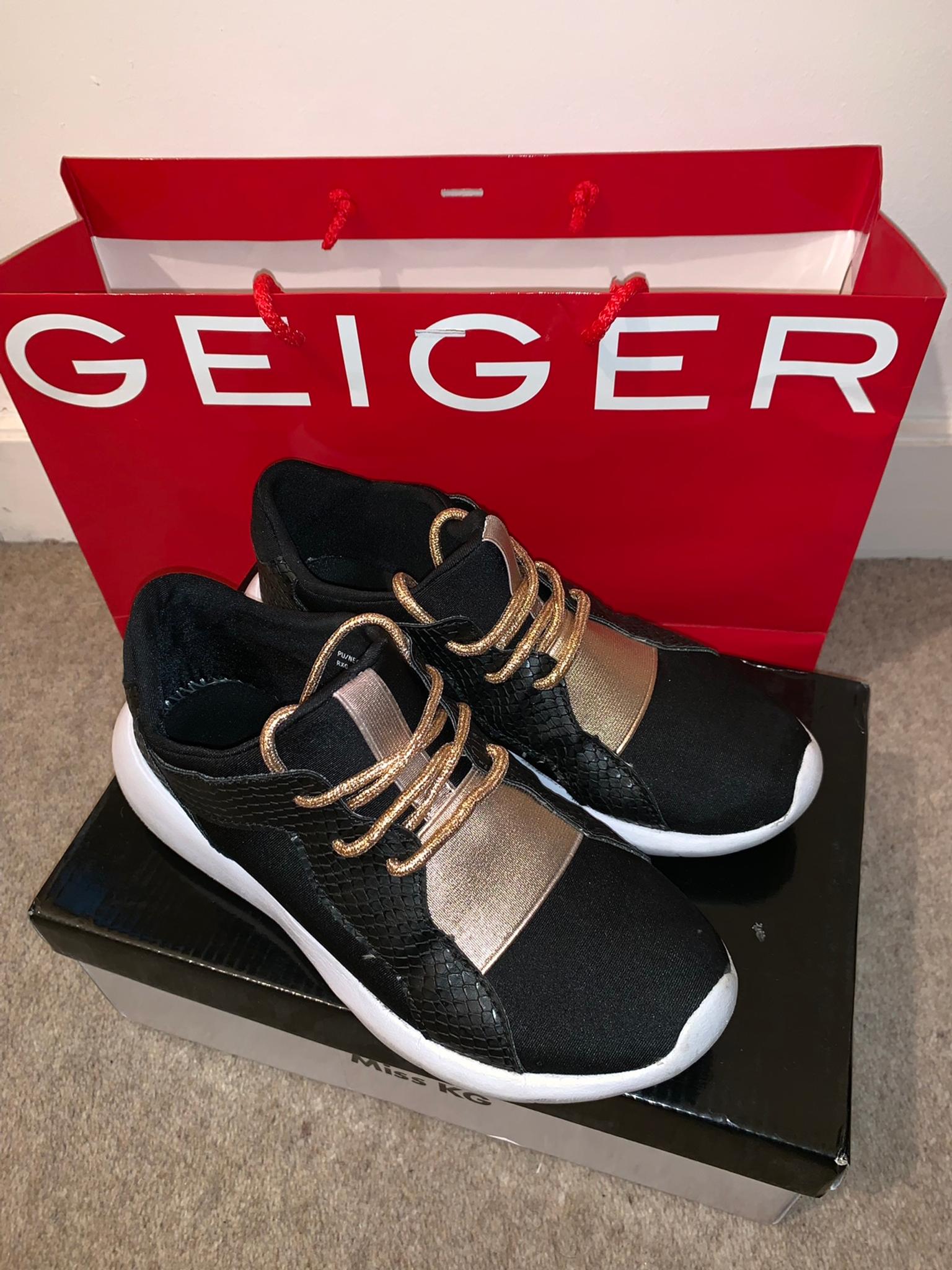 carvela black and gold trainers
