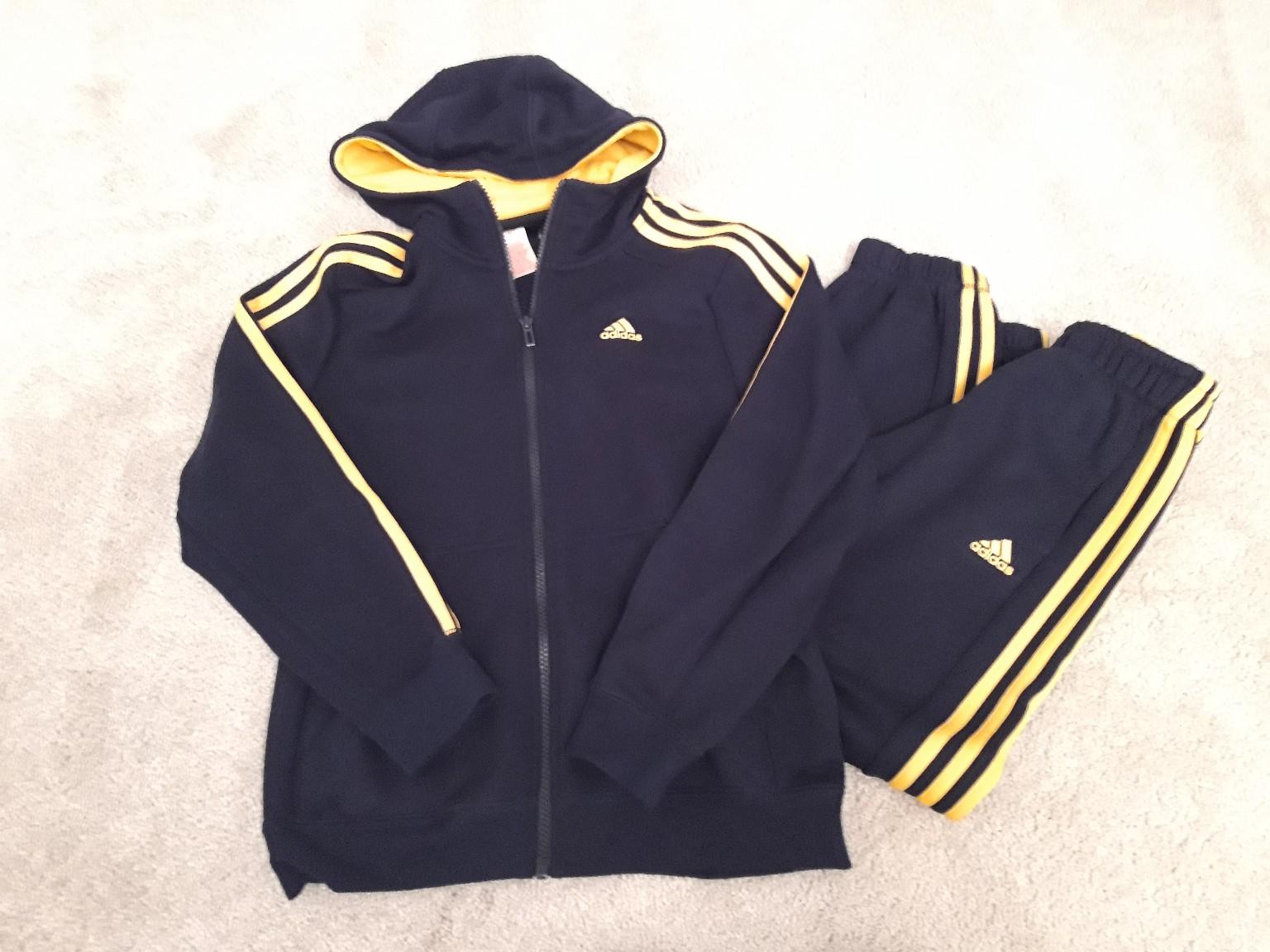 navy blue and yellow adidas tracksuit