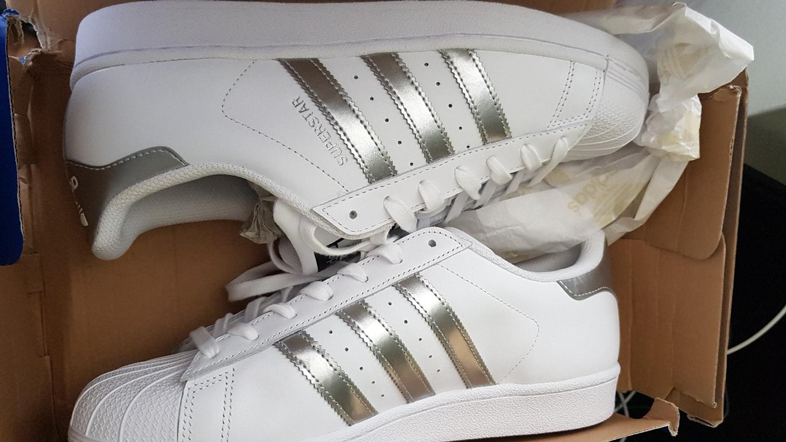 adidas white and silver superstar trainers
