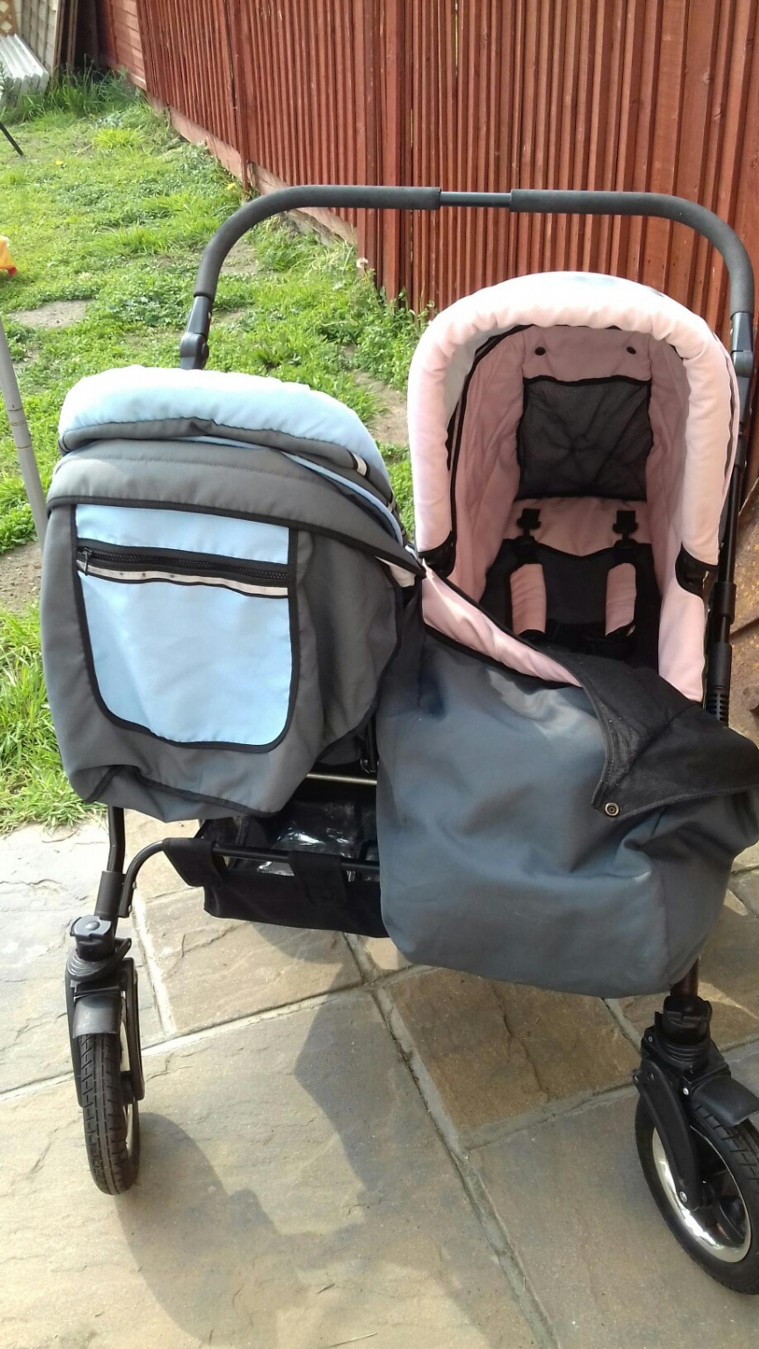 boy and girl double pushchair