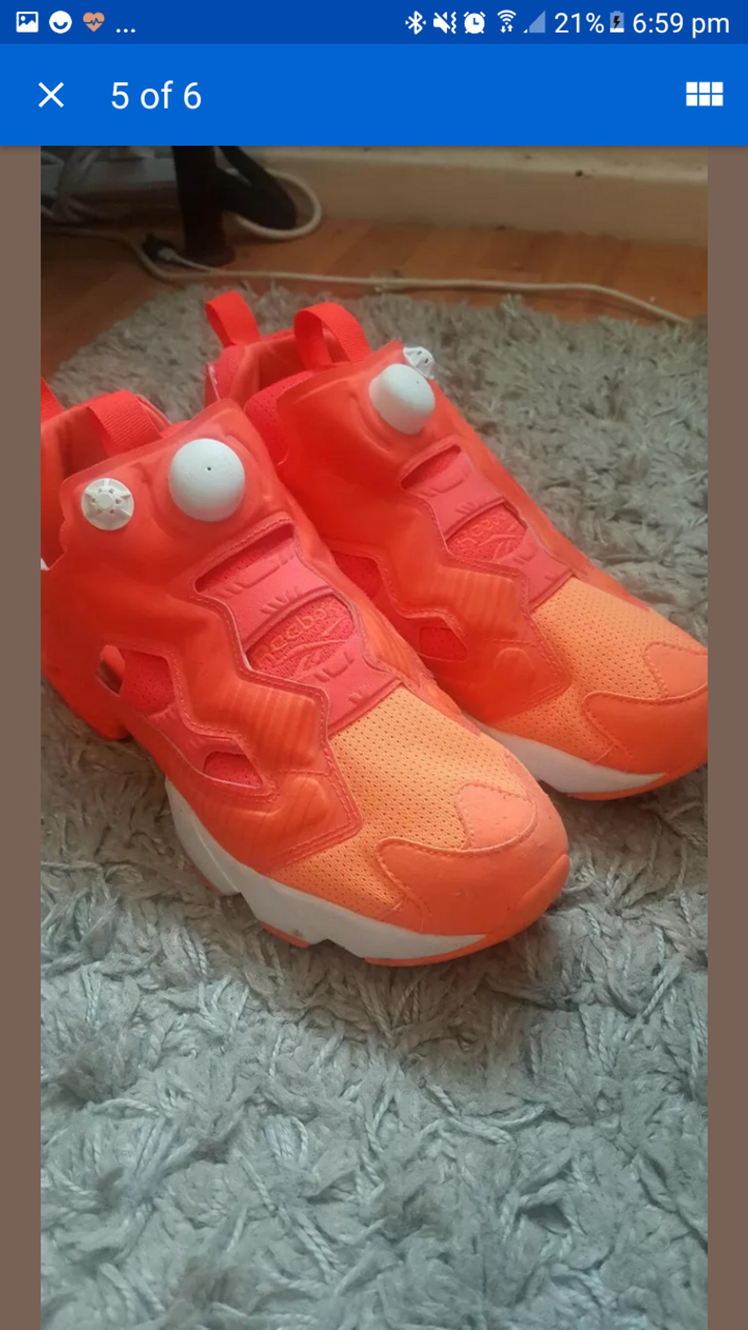 bright orange reebok trainers
