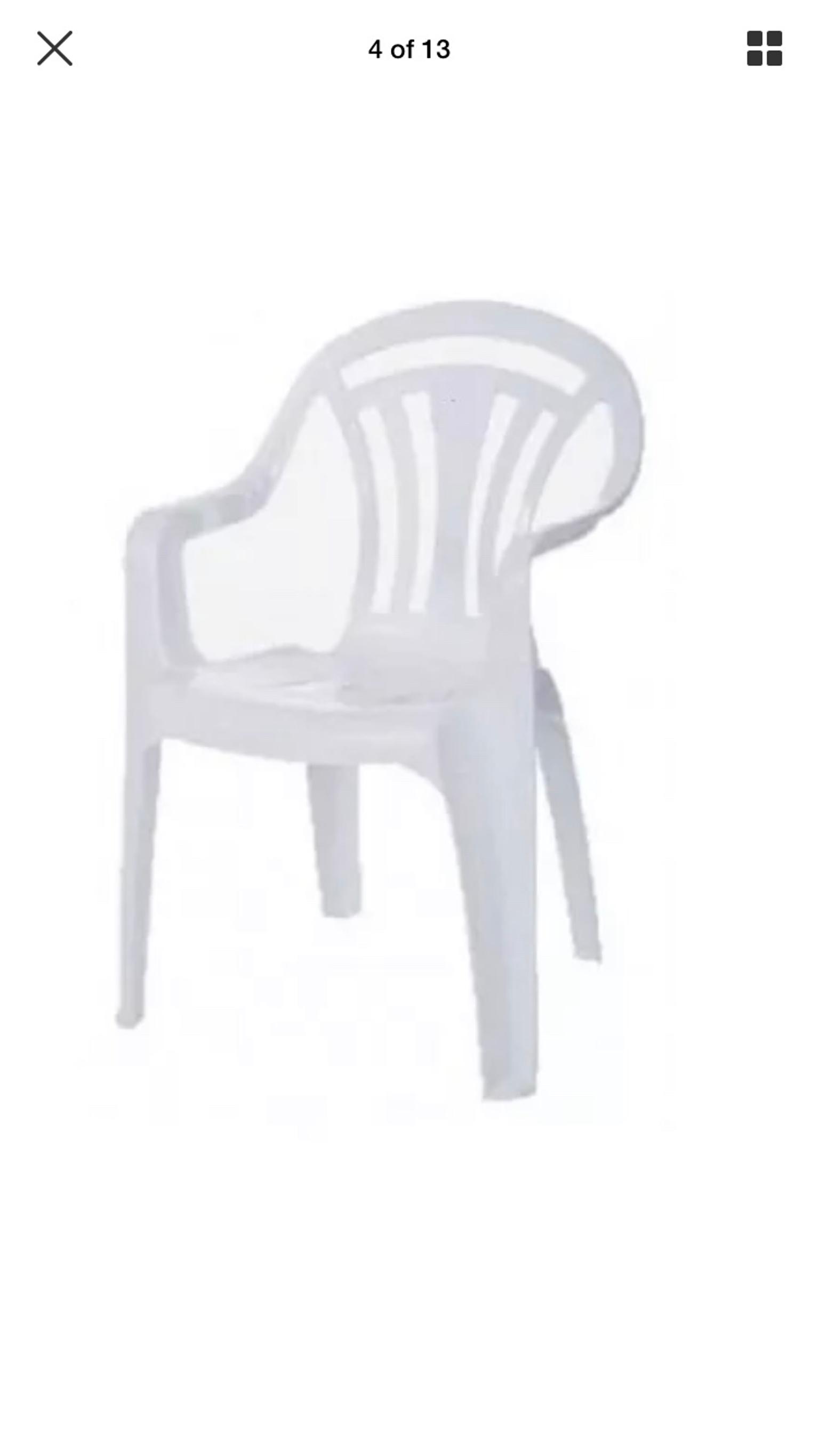 white plastic garden chairs and round table