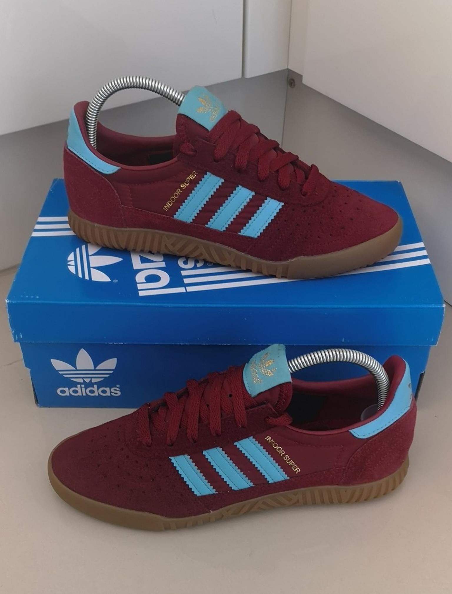claret and blue adidas trainers