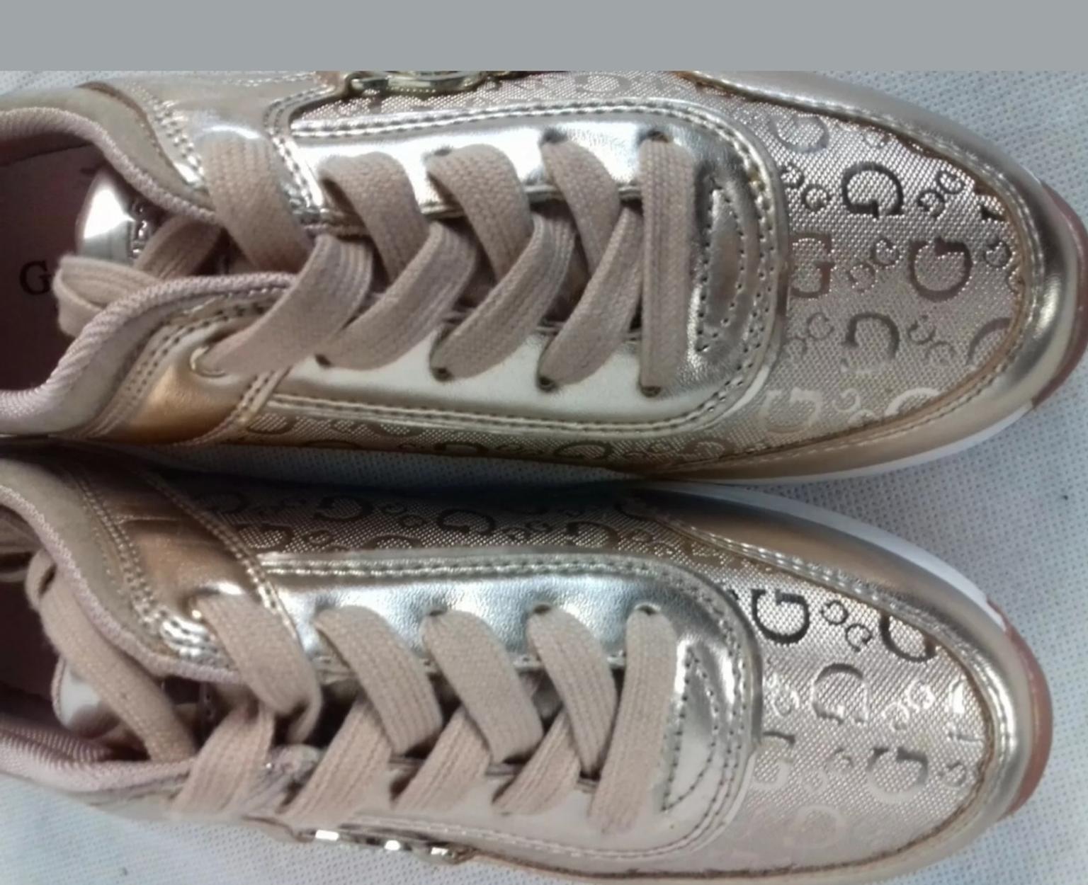 gold guess trainers