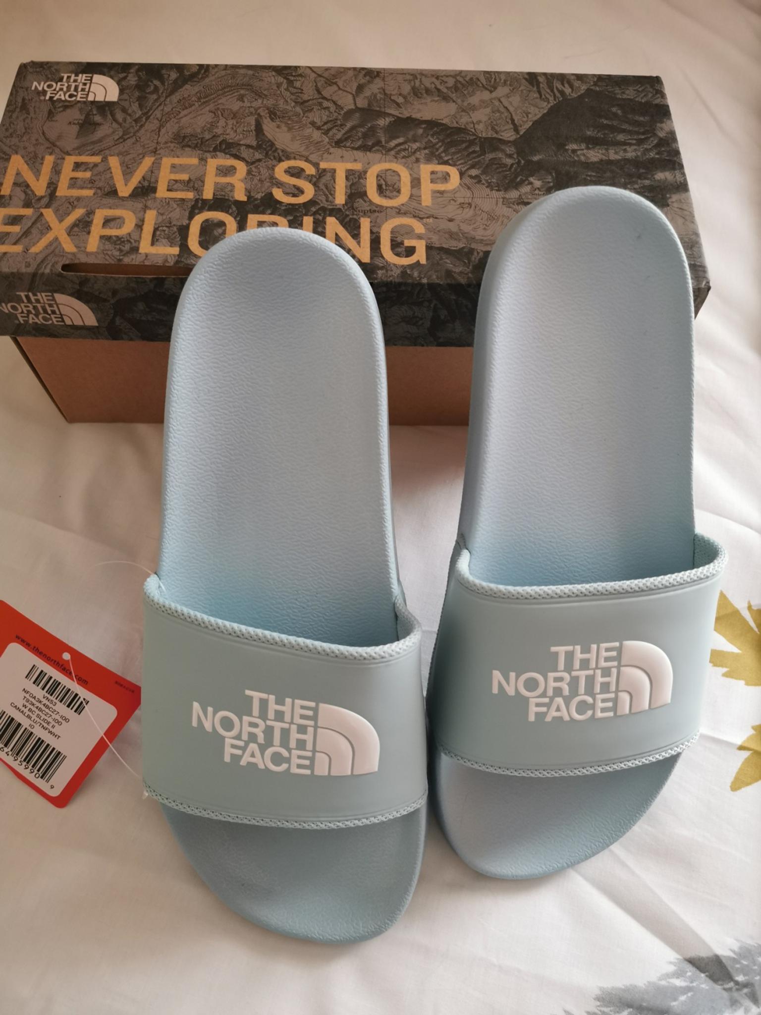 women's the North Face sliders in SG19 