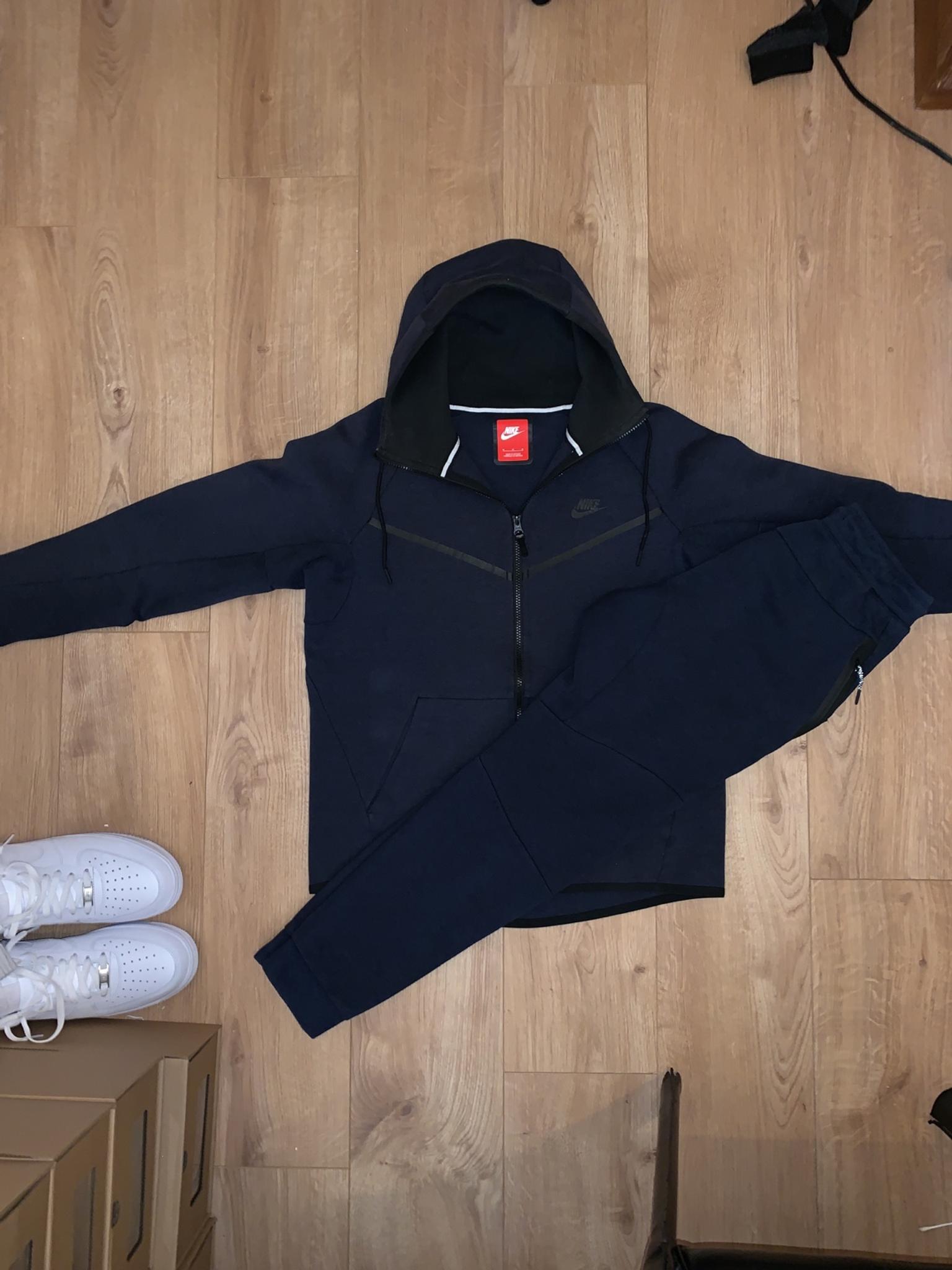 nike tech tracksuit blue and black