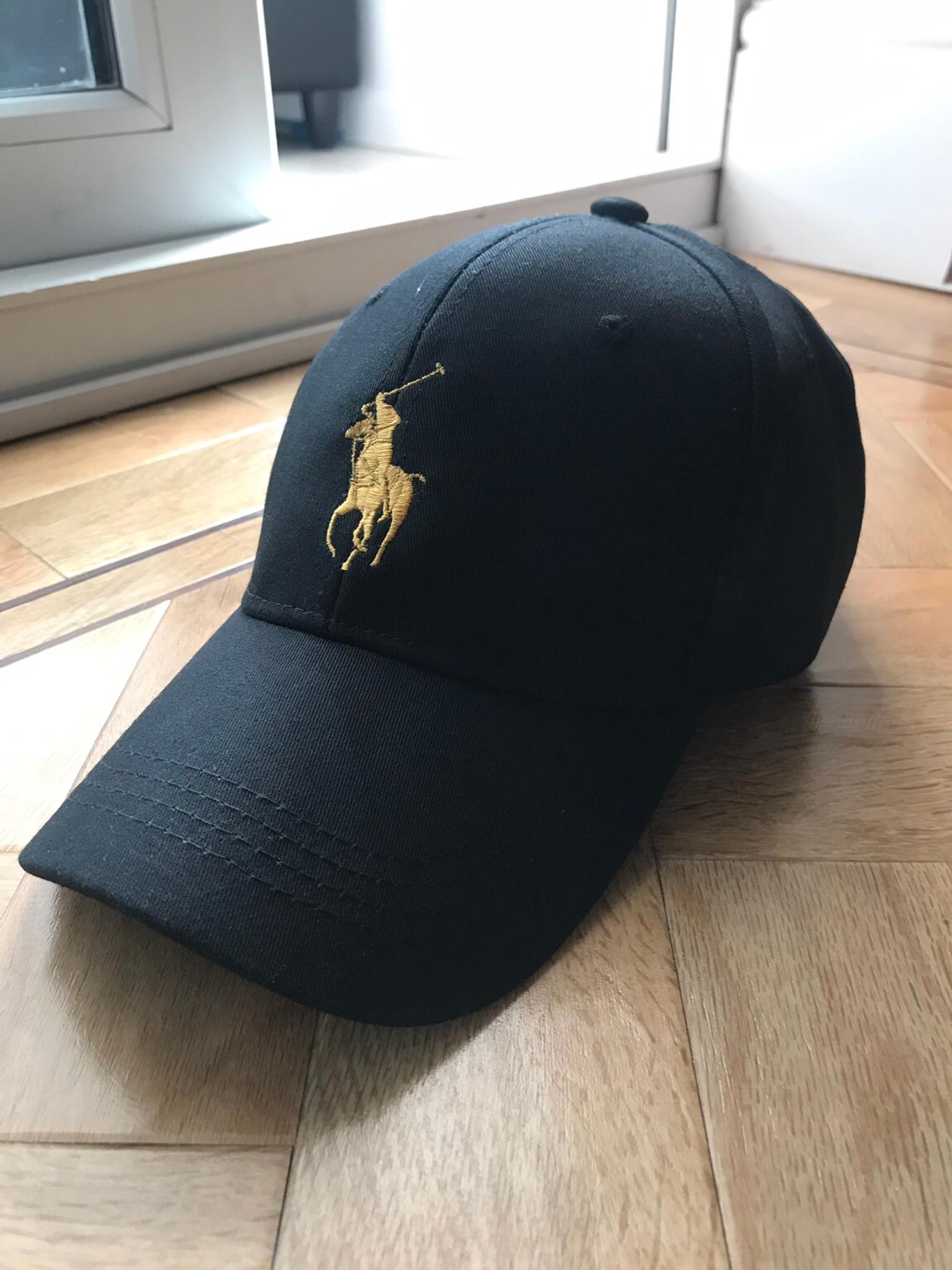 black and gold polo hat