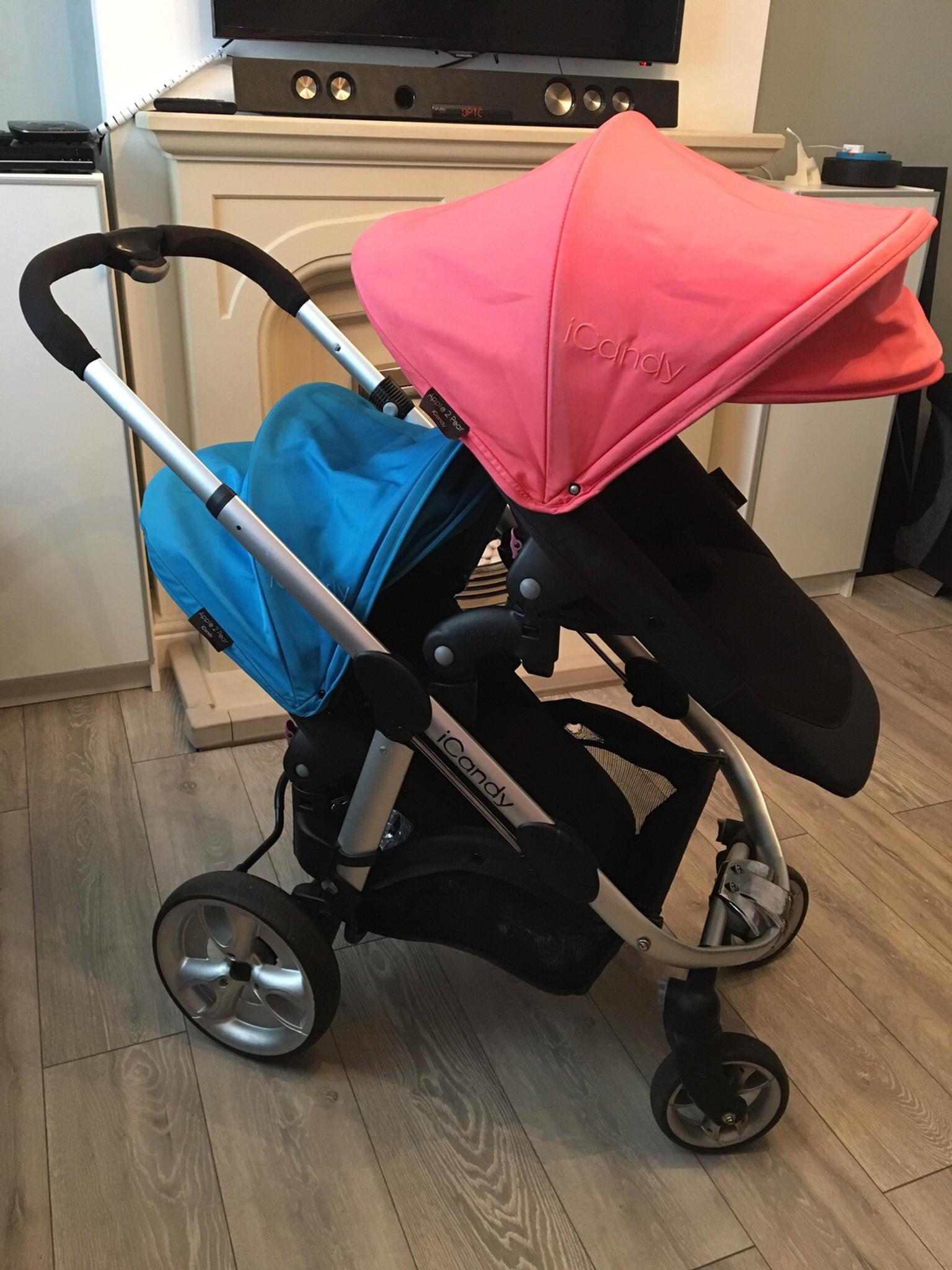 pink and blue double pram
