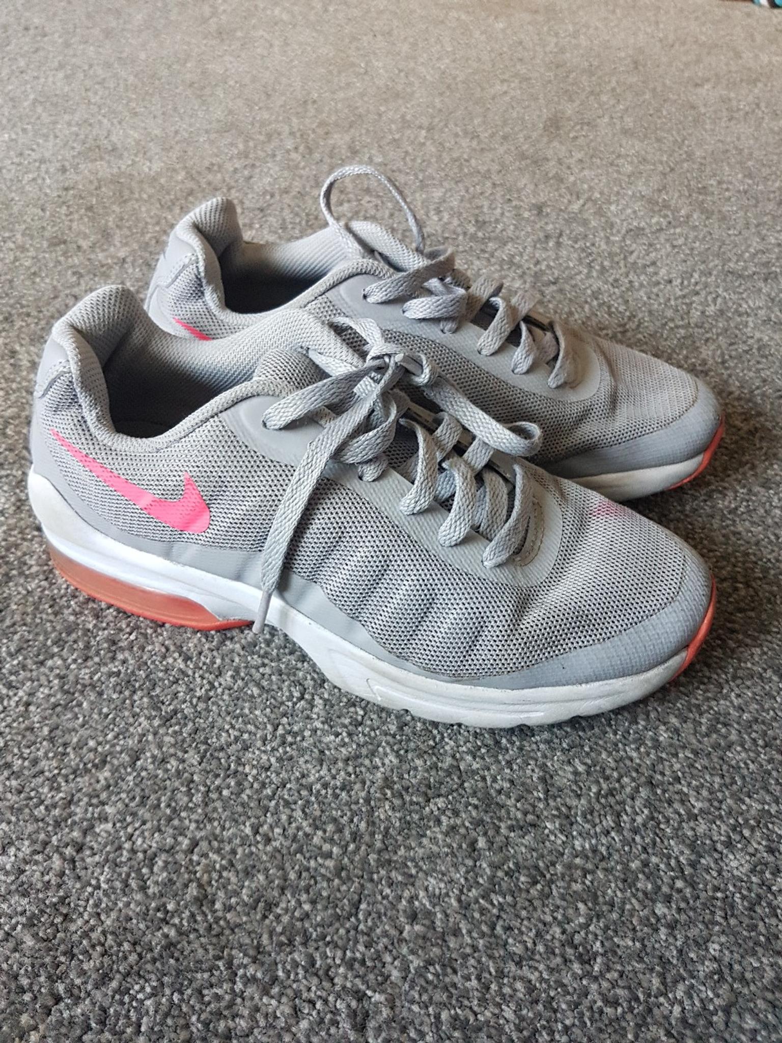 grey nike trainers with pink tick