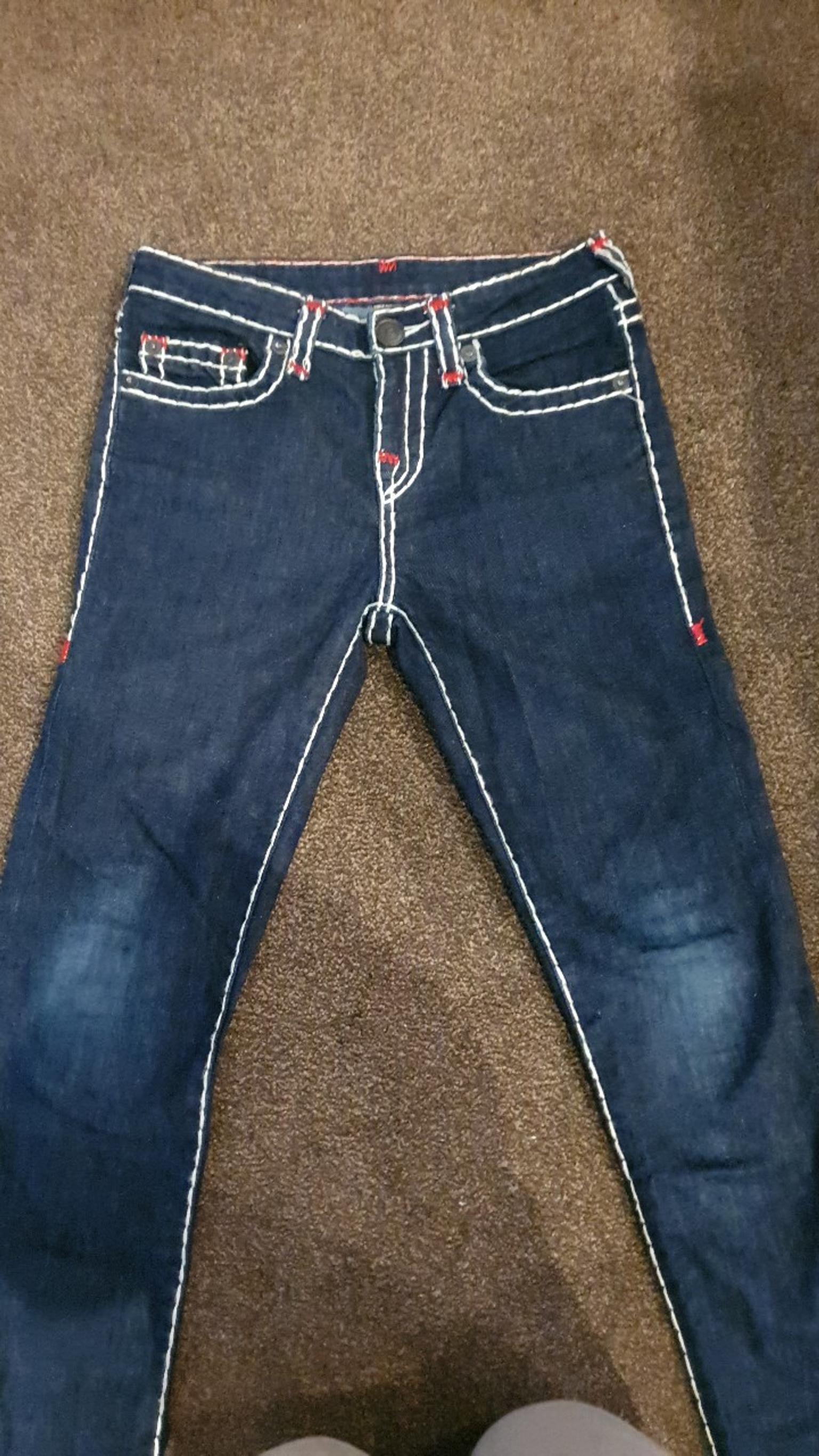 blue true religion jeans with white stitching