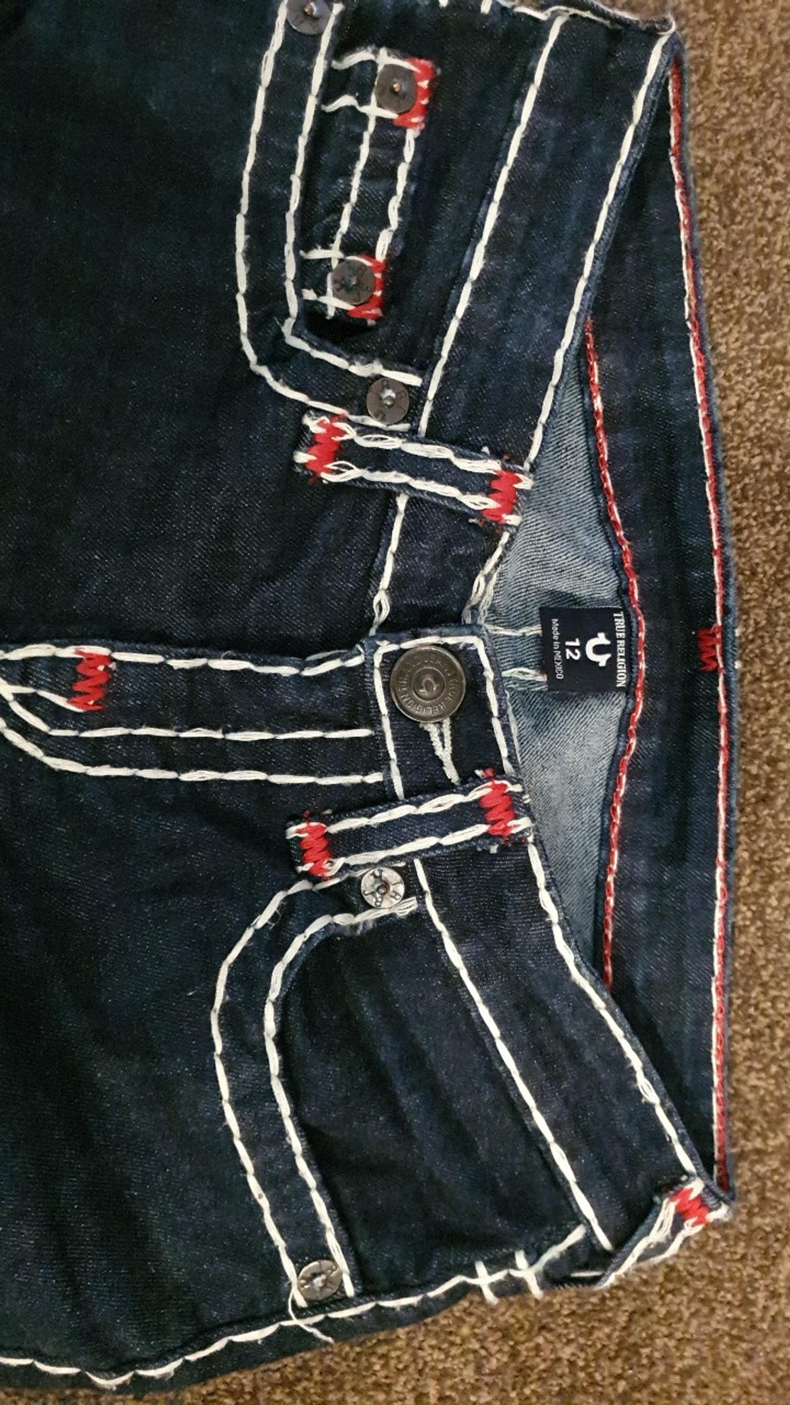 white and red true religion jeans
