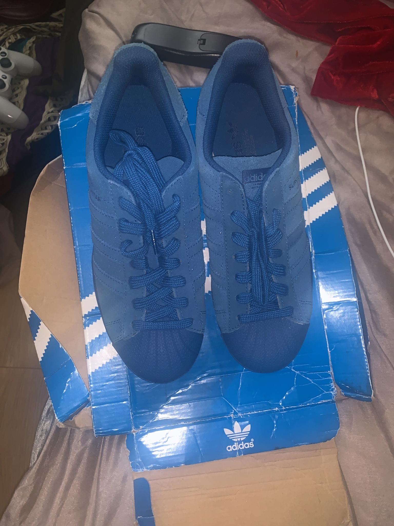 blue suede adidas trainers